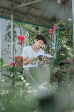 A vibrant illustration of children reading stories in a lush garden.