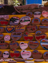 a bunch of wooden signs on a wall