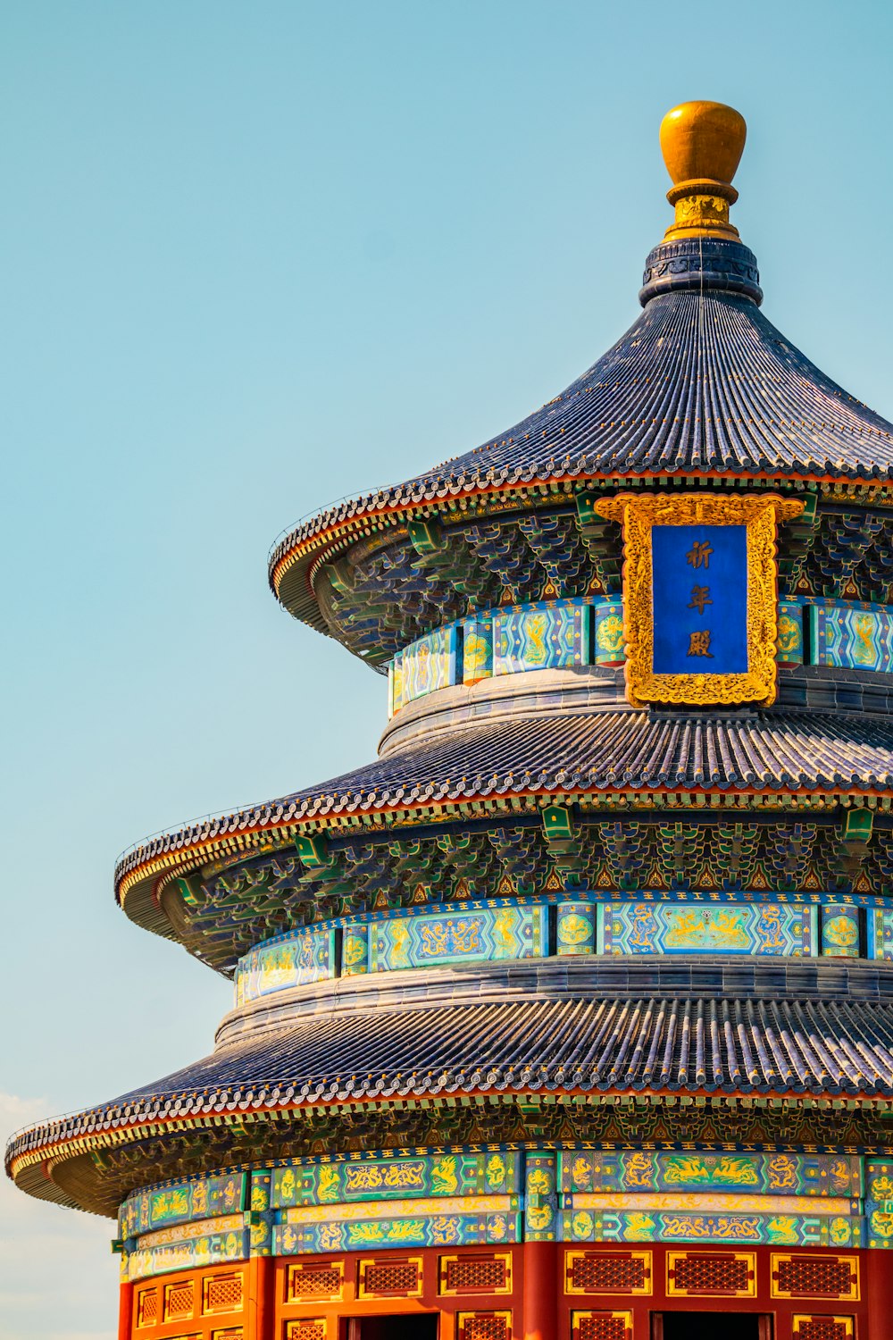 a tall building with a clock on the top of it