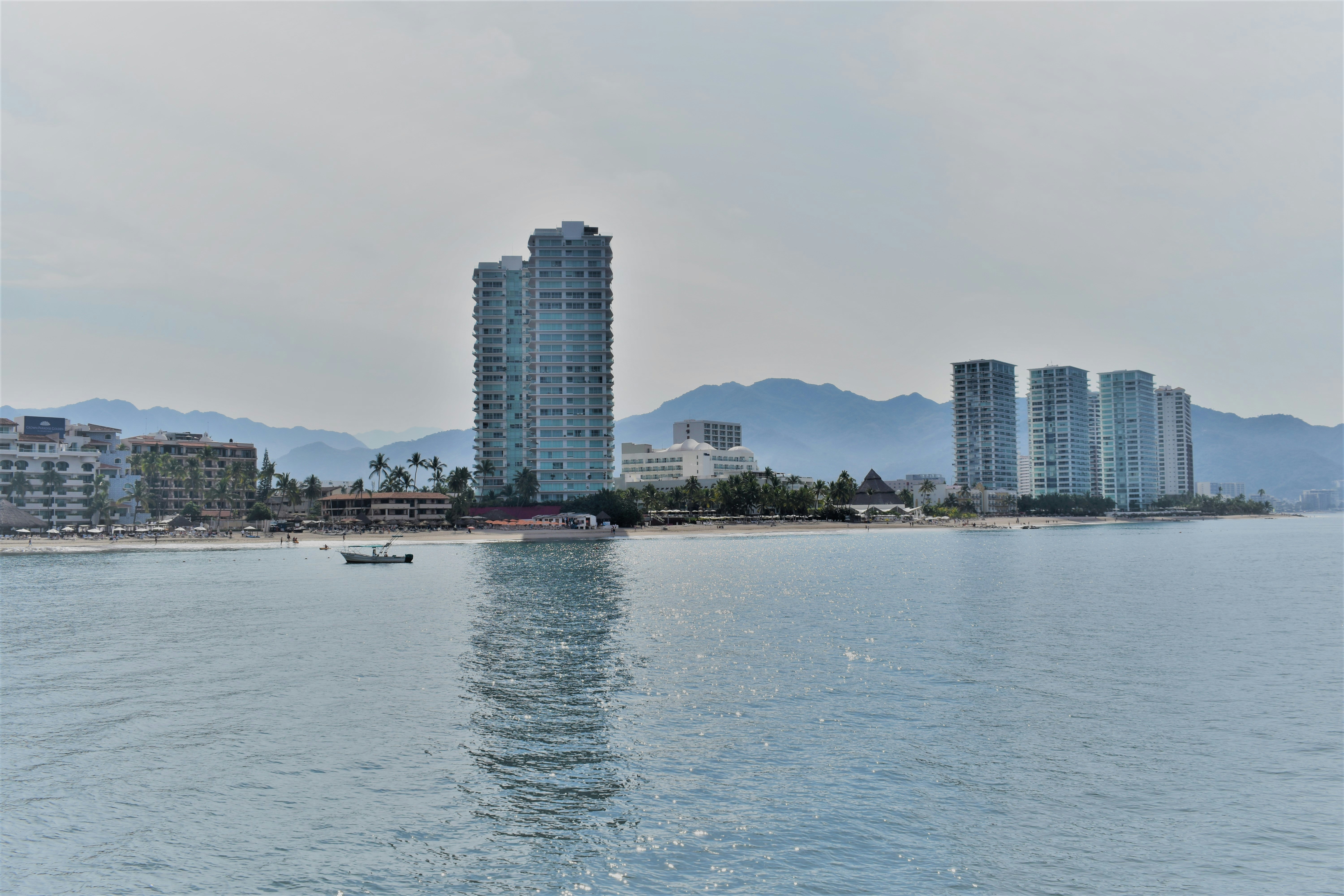 a body of water with buildings in the background