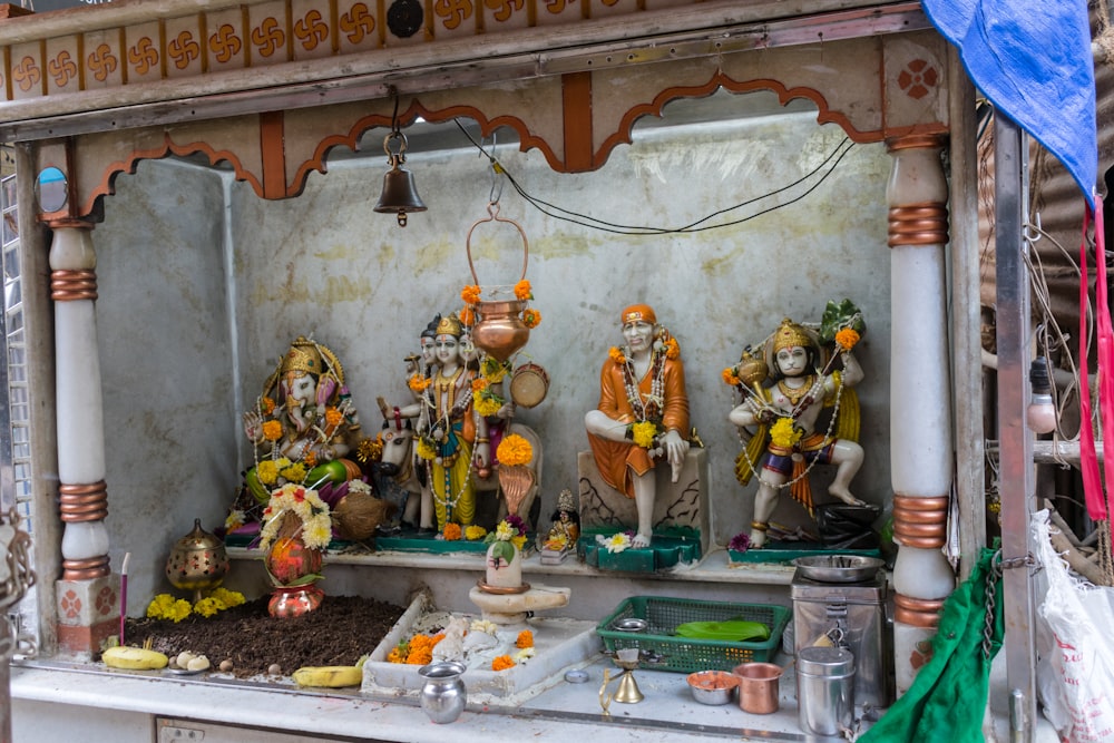 a shrine with statues of hindu deities in it