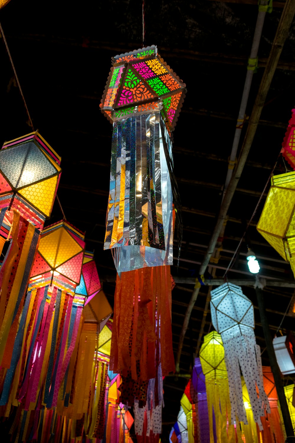 a group of colorful lights hanging from the ceiling