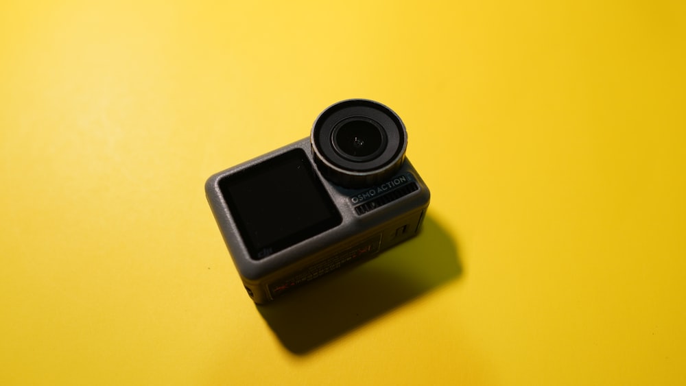 a camera sitting on top of a yellow table