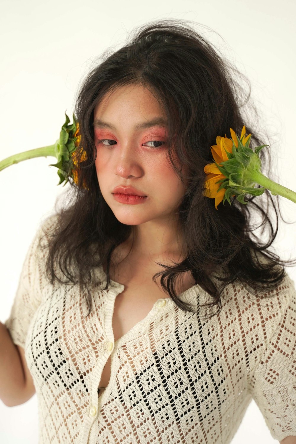 a woman with a flower in her hair