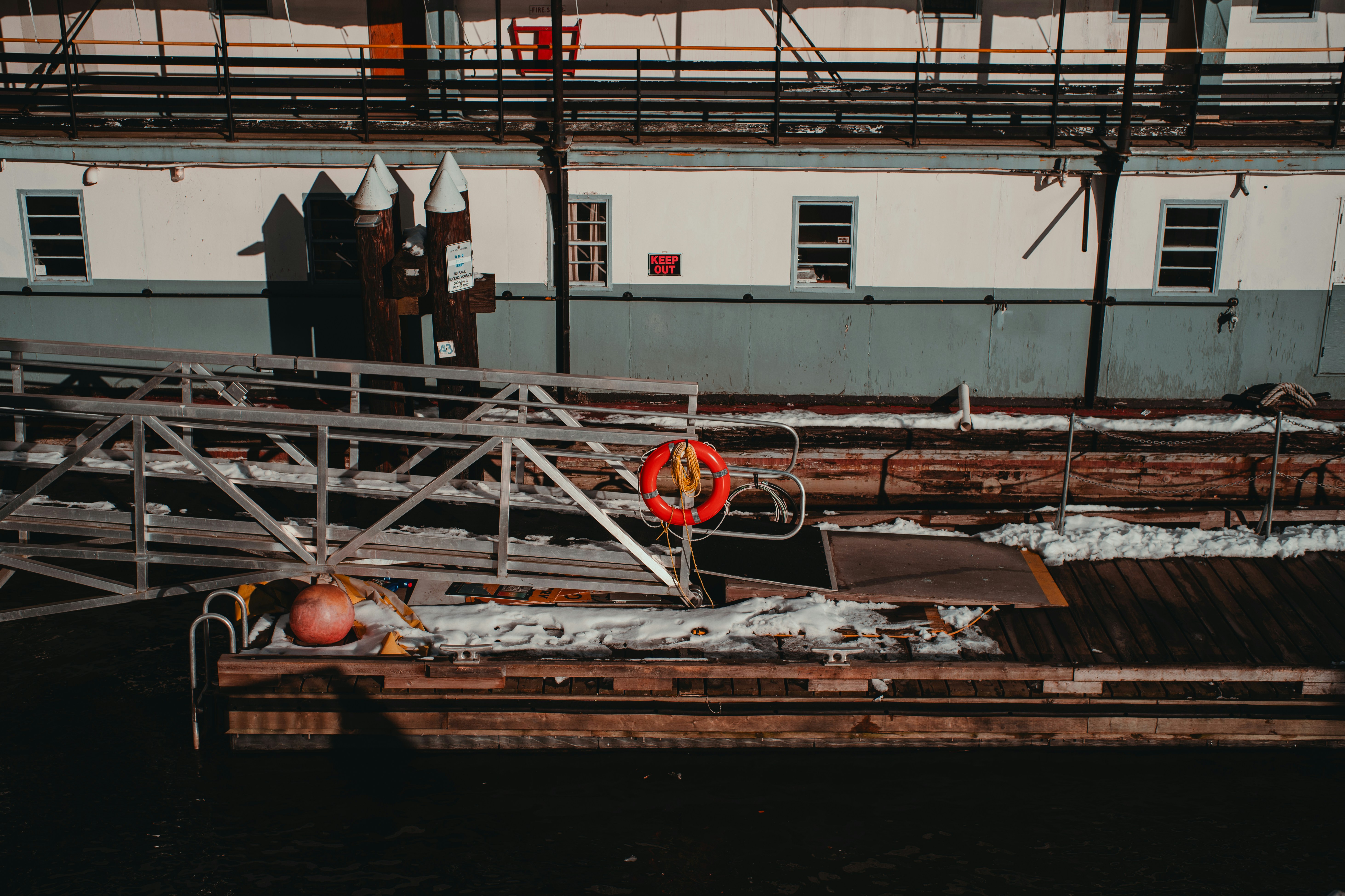 a rusted out boat sitting in a body of water