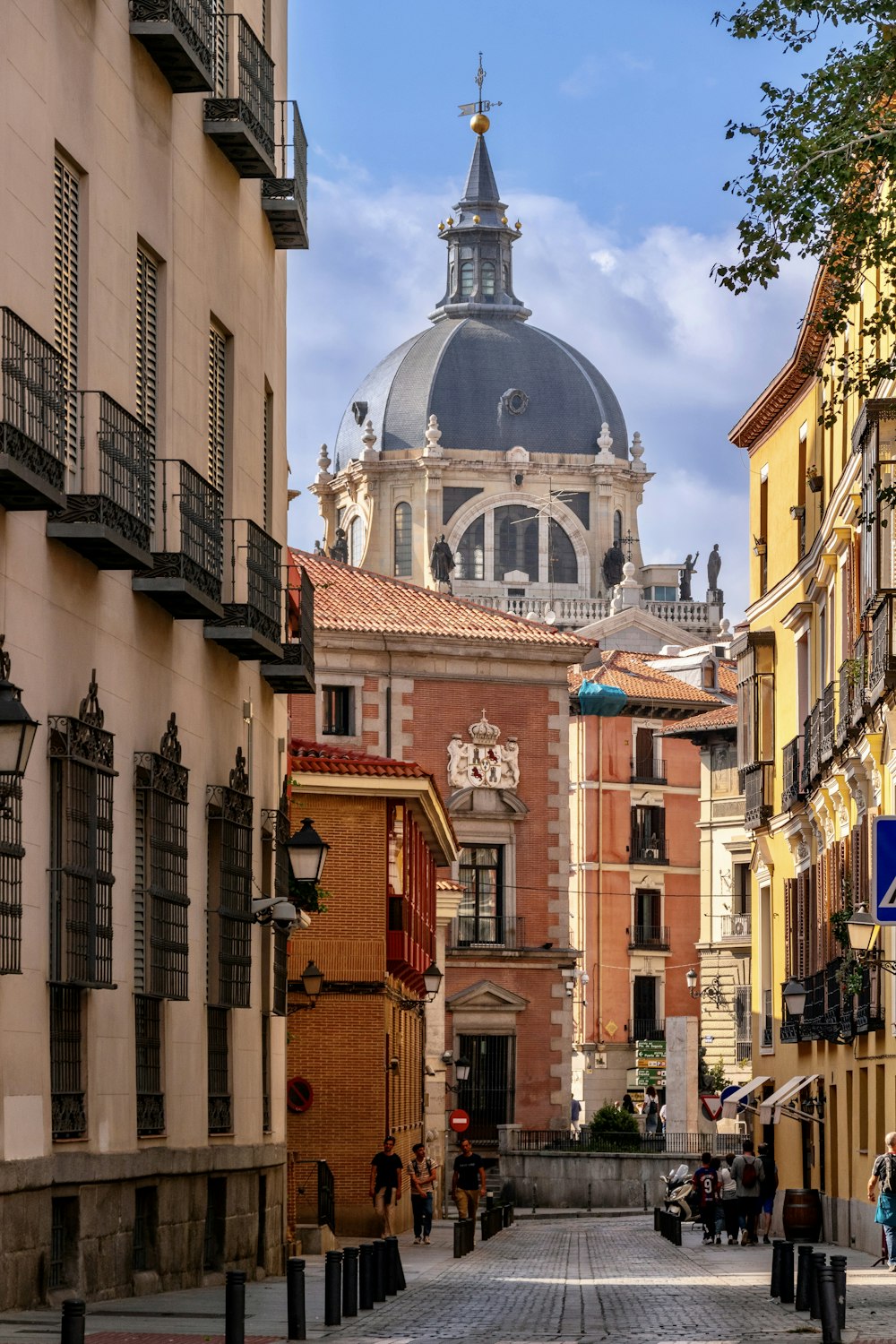 a city street with a church in the background