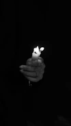 Artisan hands carefully crafting a candle, highlighting the attention to detail and quality.