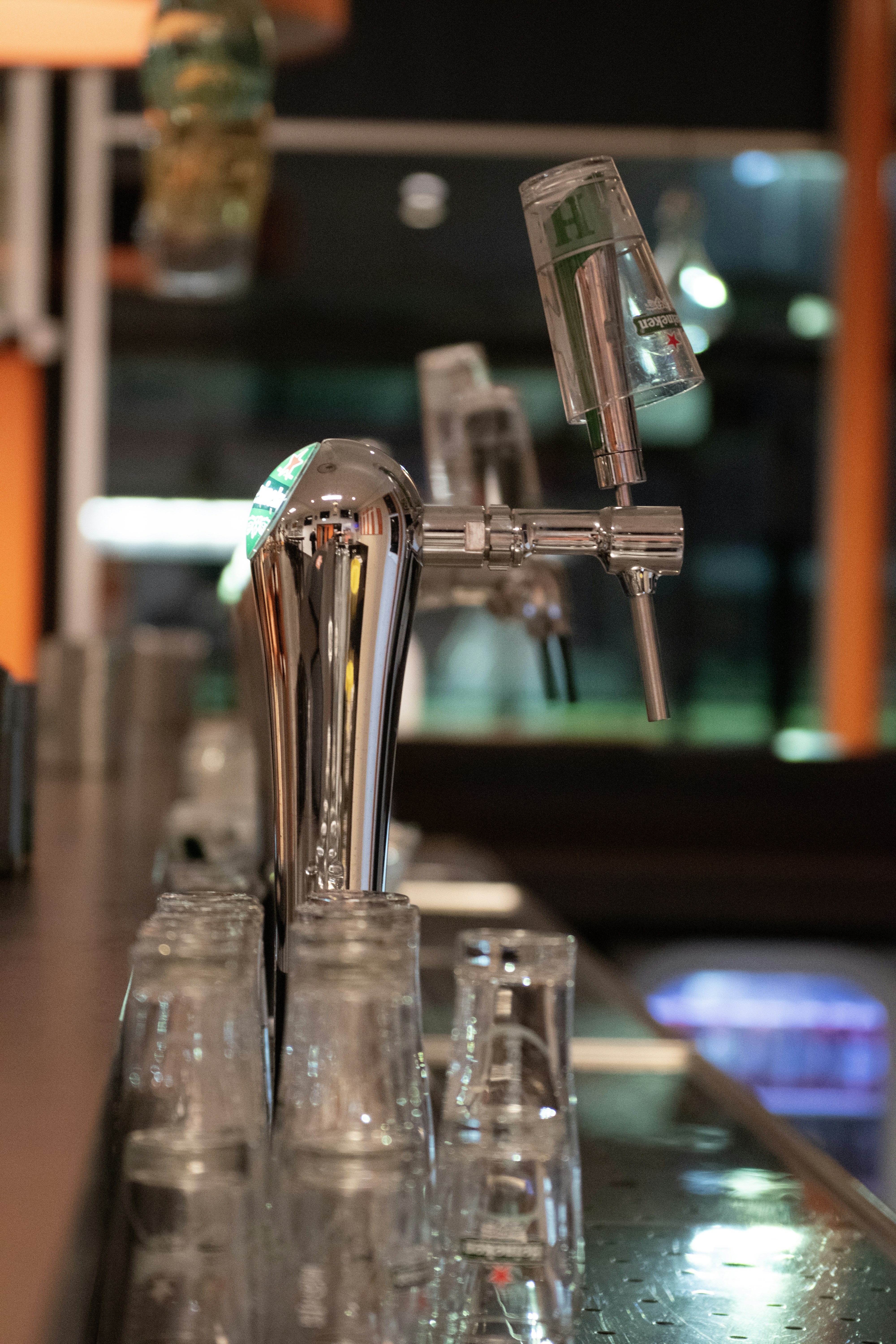 a row of shot glasses sitting on top of a bar