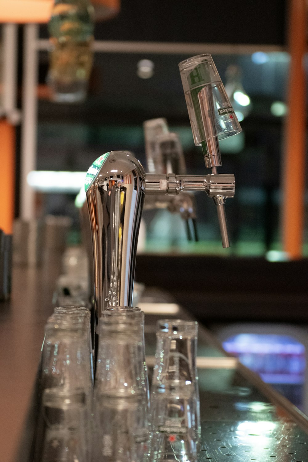 a row of shot glasses sitting on top of a bar