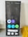 A large rectangular item resembling a smartphone screen is displayed, featuring various app icons on a dark background. The icons include popular social media and communication apps, arranged in a grid. The upper part shows symbols for time, battery, and network, while the lower portion has a navigation bar and app buttons.