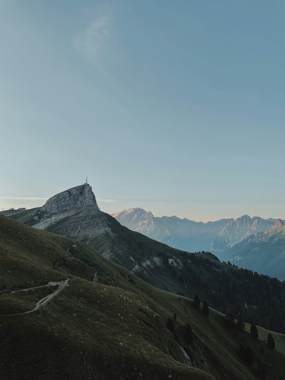 a view of a mountain with a trail going through it