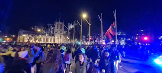 A vibrant crowd gathered at a local Atlanta church event, highlighting community spirit under evening lights.