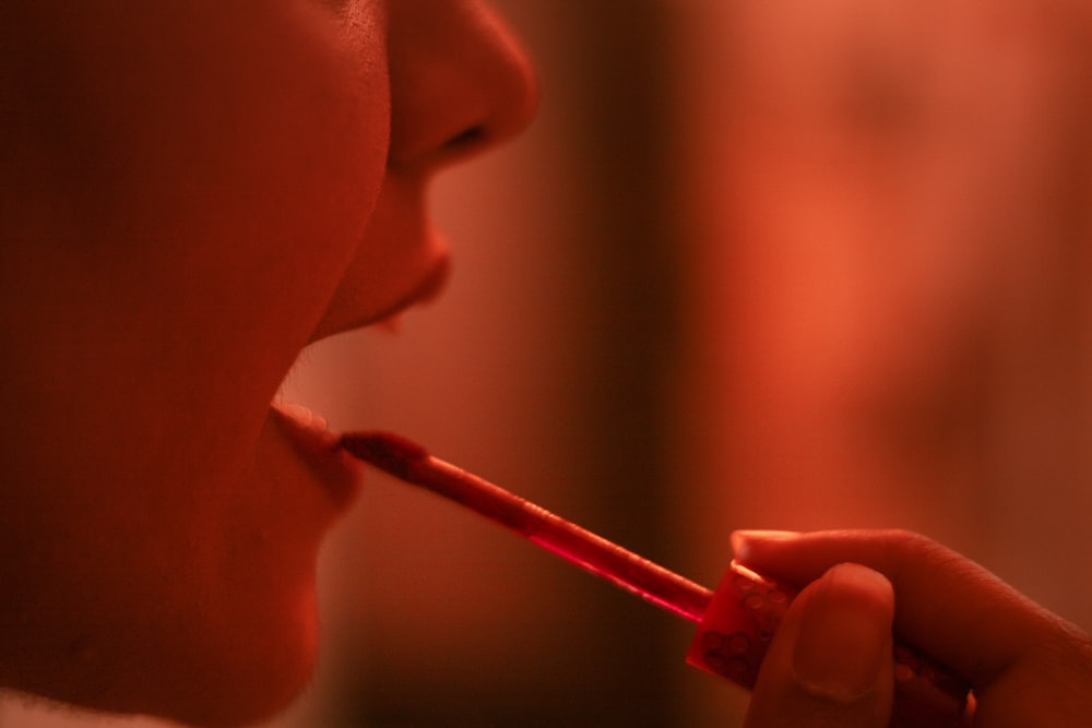 a close up of a person brushing their teeth