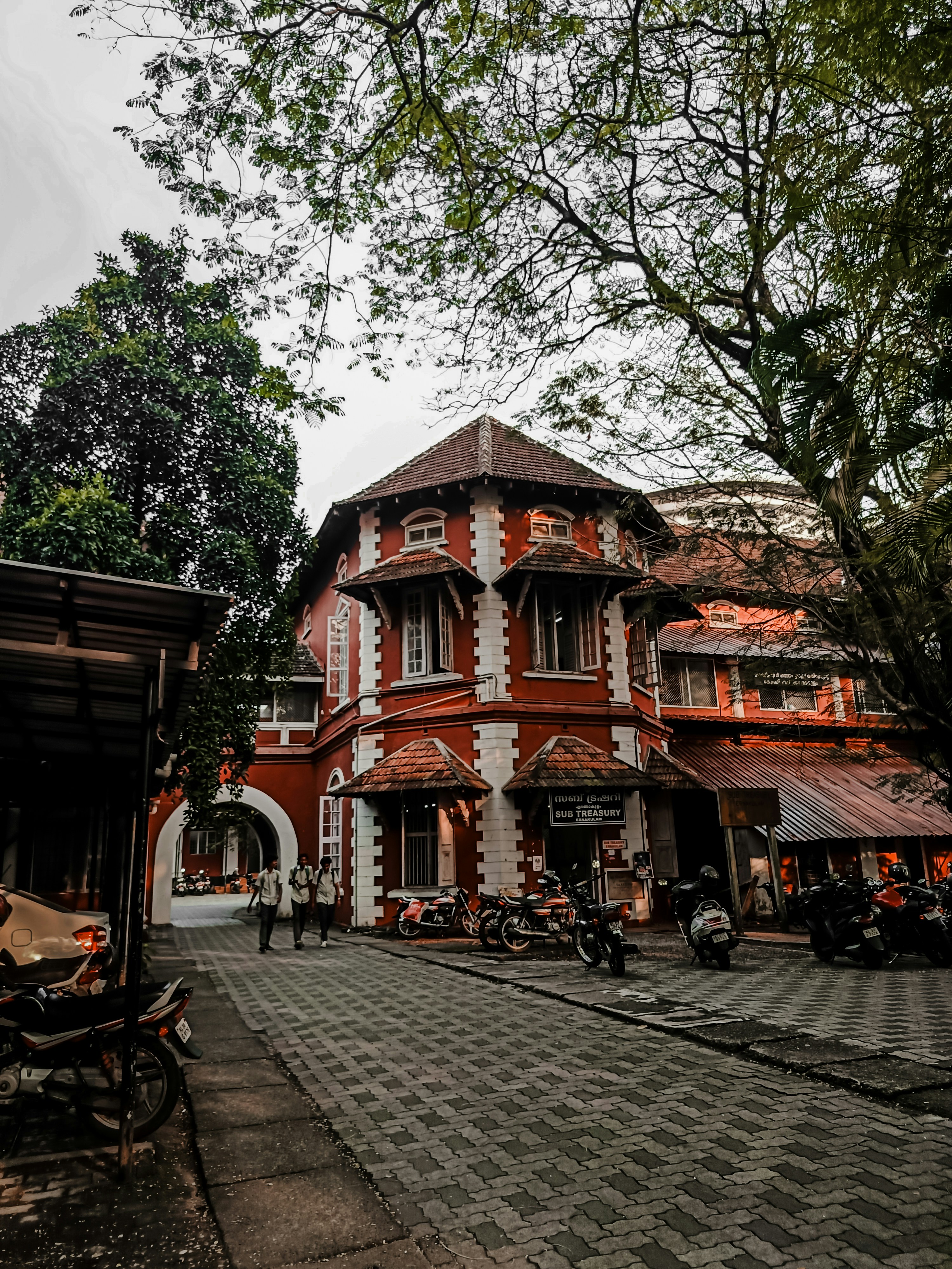 a red and white building sitting on the side of a road