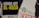 A protest sign displays bold yellow and white text against a black background reading 'Hands Off Al-Aqsa.' Nearby, another sign with the logo of the Muslim Association of Britain emphasizes its message.