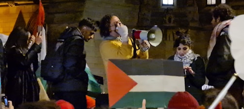 A political rally in the Central African Republic with passionate speakers and attentive crowd.