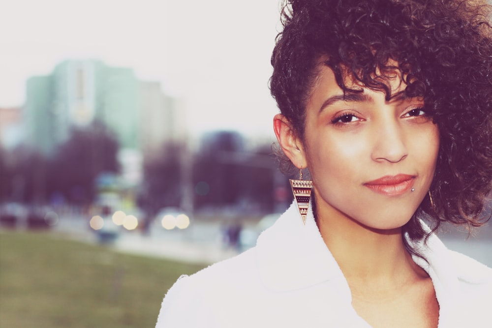 a close up of a person wearing a white shirt