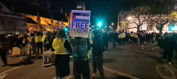 A heartfelt scene of volunteers distributing food and medical supplies in Gaza under the golden light of sunset.