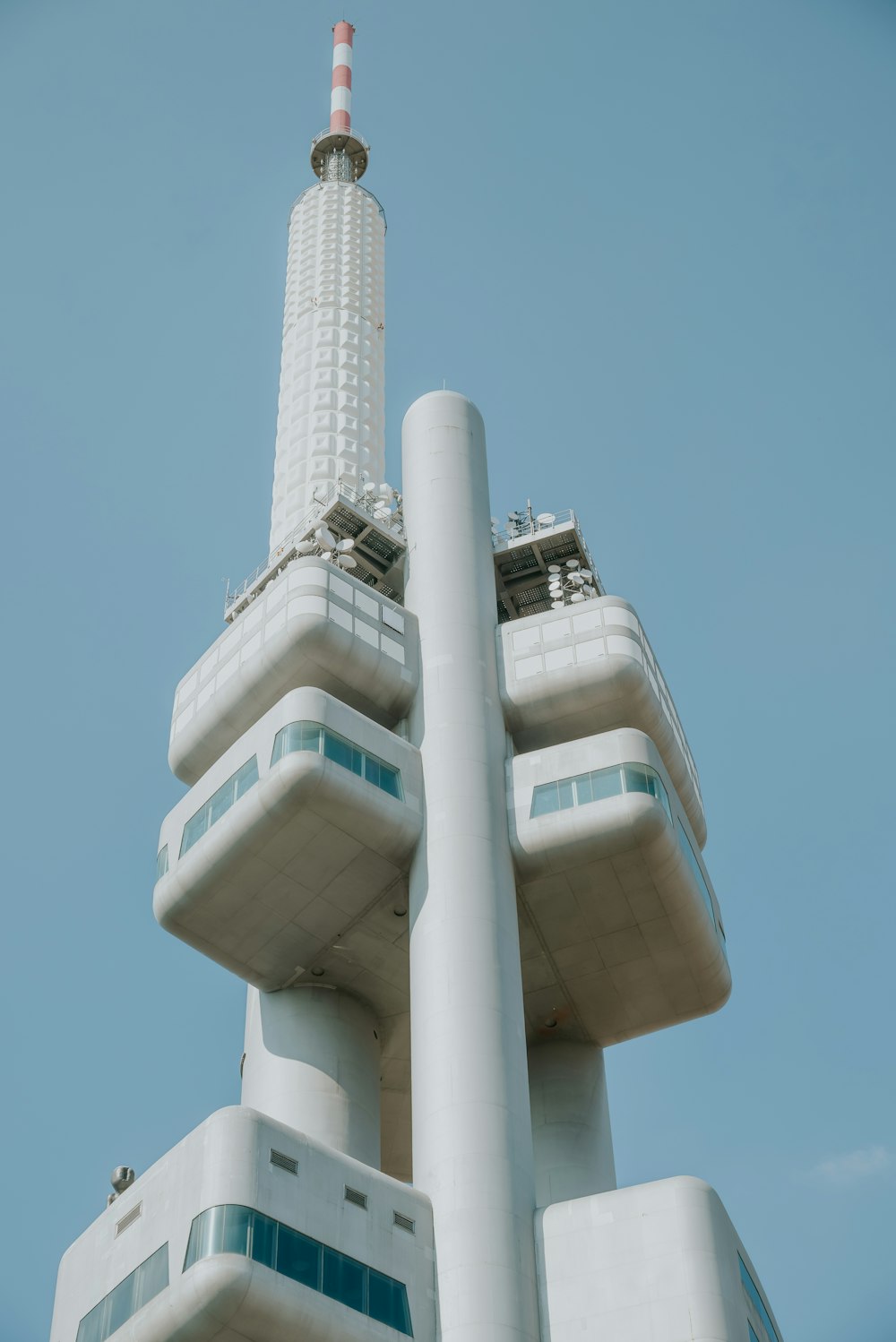 a tall white building with a sky background