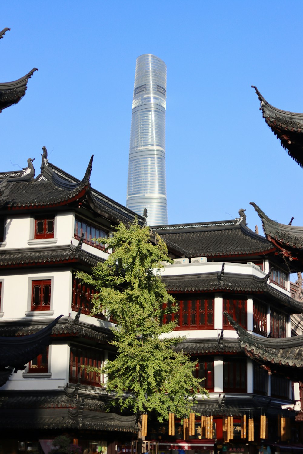 a tall building with a very tall tower in the background