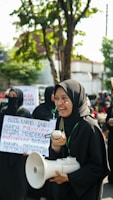 A group of smiling community members holding 'trunk' meme coin signs at a casual meetup