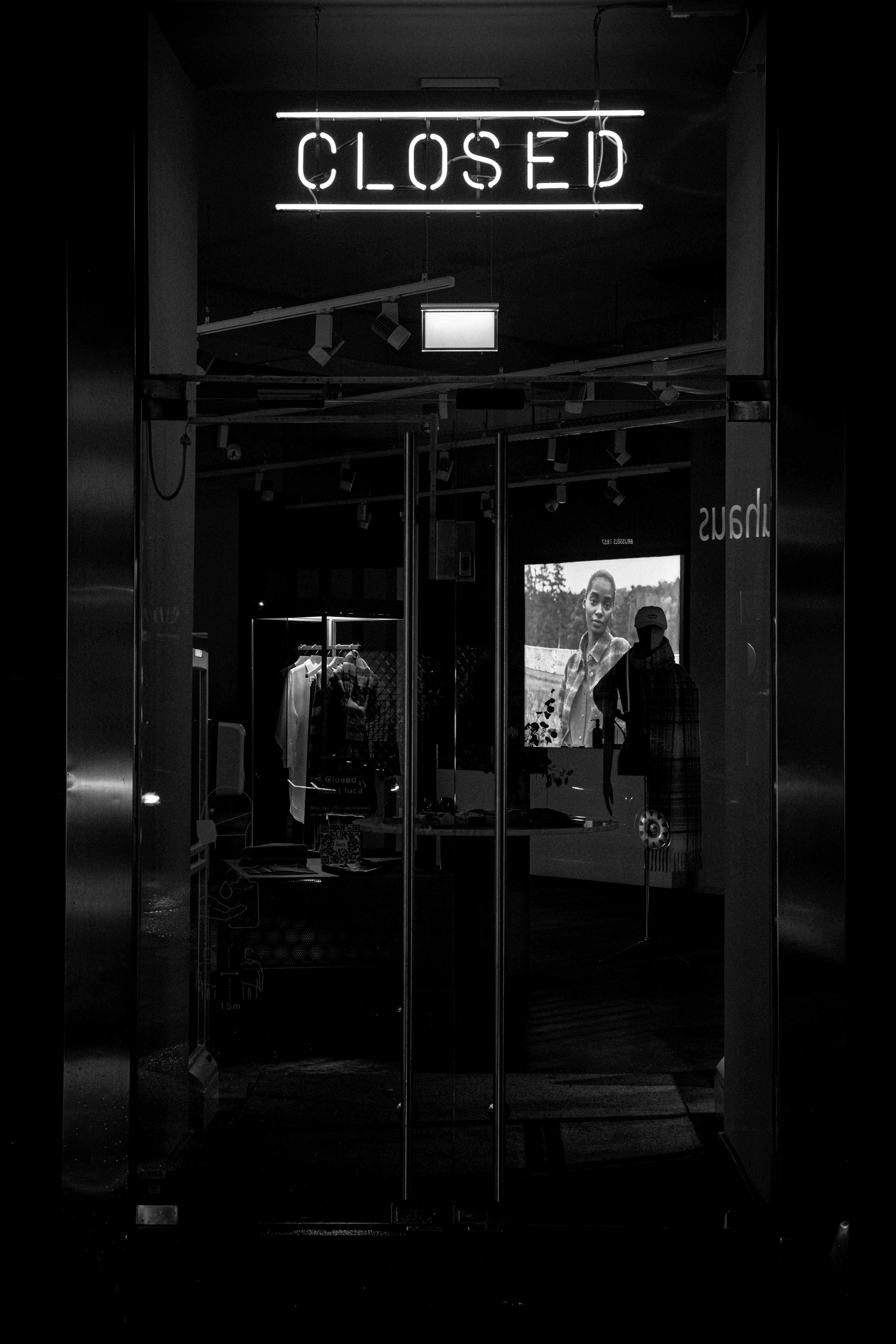 a black and white photo of a closed store