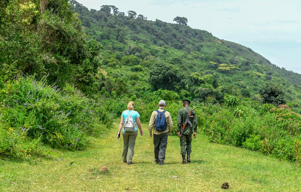 a group of people walking up a hill