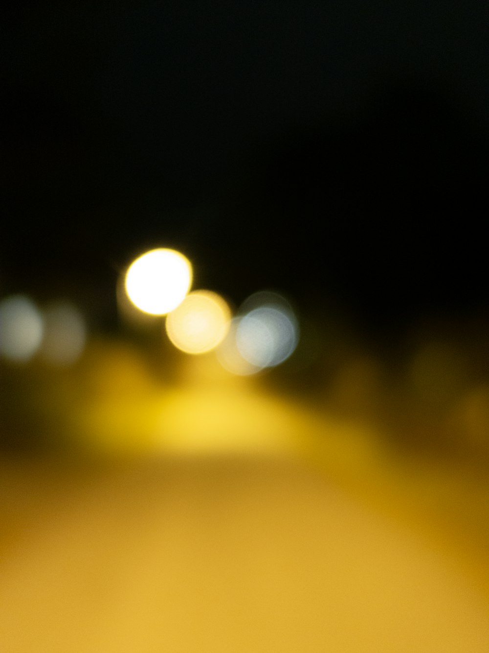 a blurry photo of a street at night