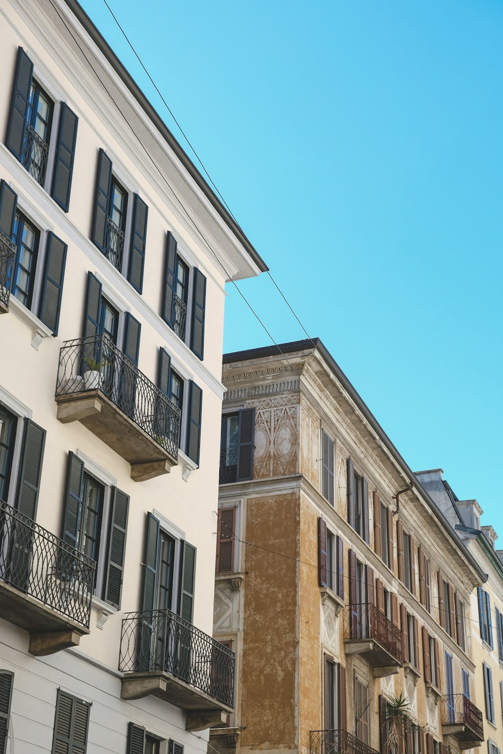 a row of buildings with balconies and balconies on the balcon