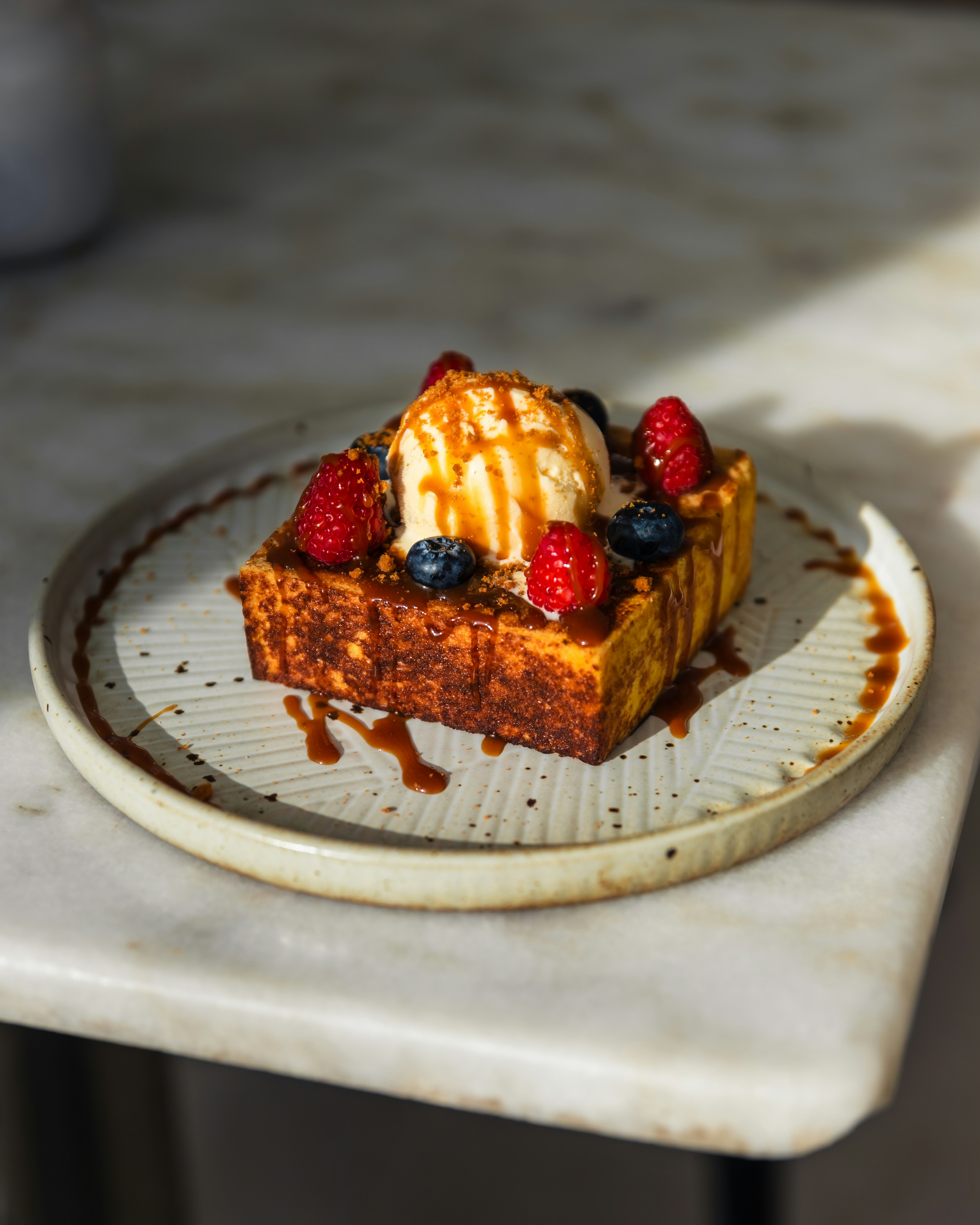 A piece of cake with ice cream and berries on top photo – Free Food ...