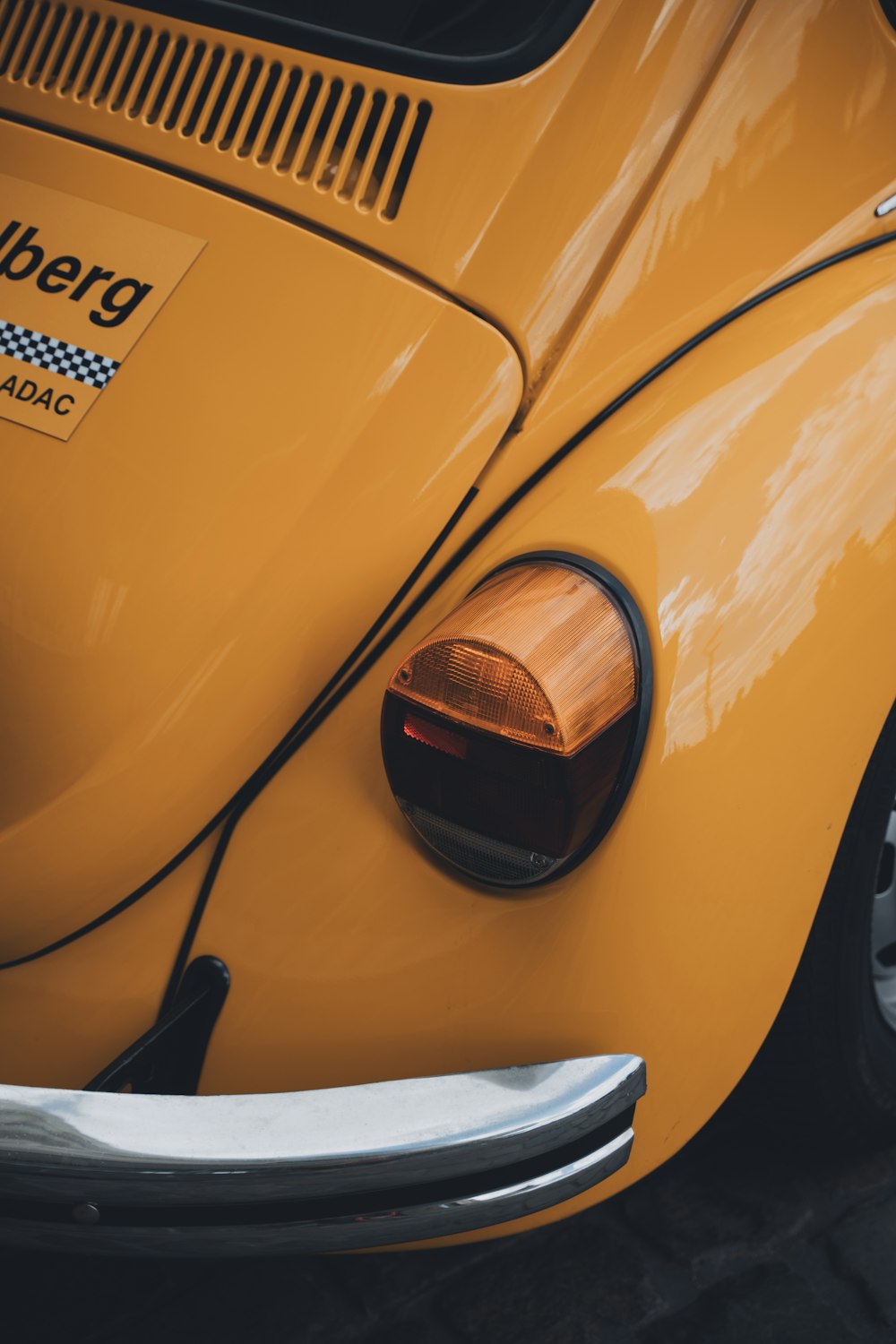 a close up of a yellow vw bug