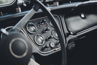 Close-up of a classic car's dashboard with modern digital overlays highlighting engagement stats.