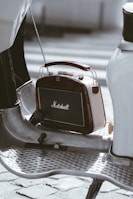 a small radio sitting on top of a metal table