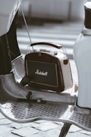 a small radio sitting on top of a metal table