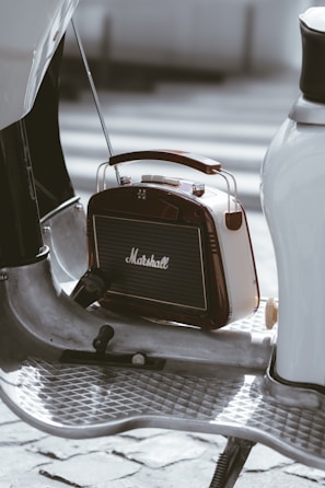 a small radio sitting on top of a metal table