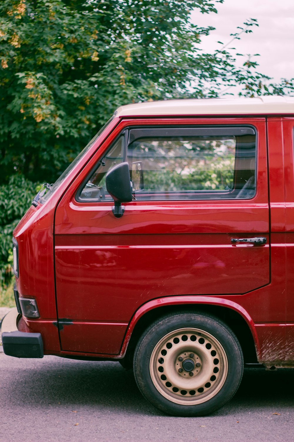 a red van parked on the side of the road