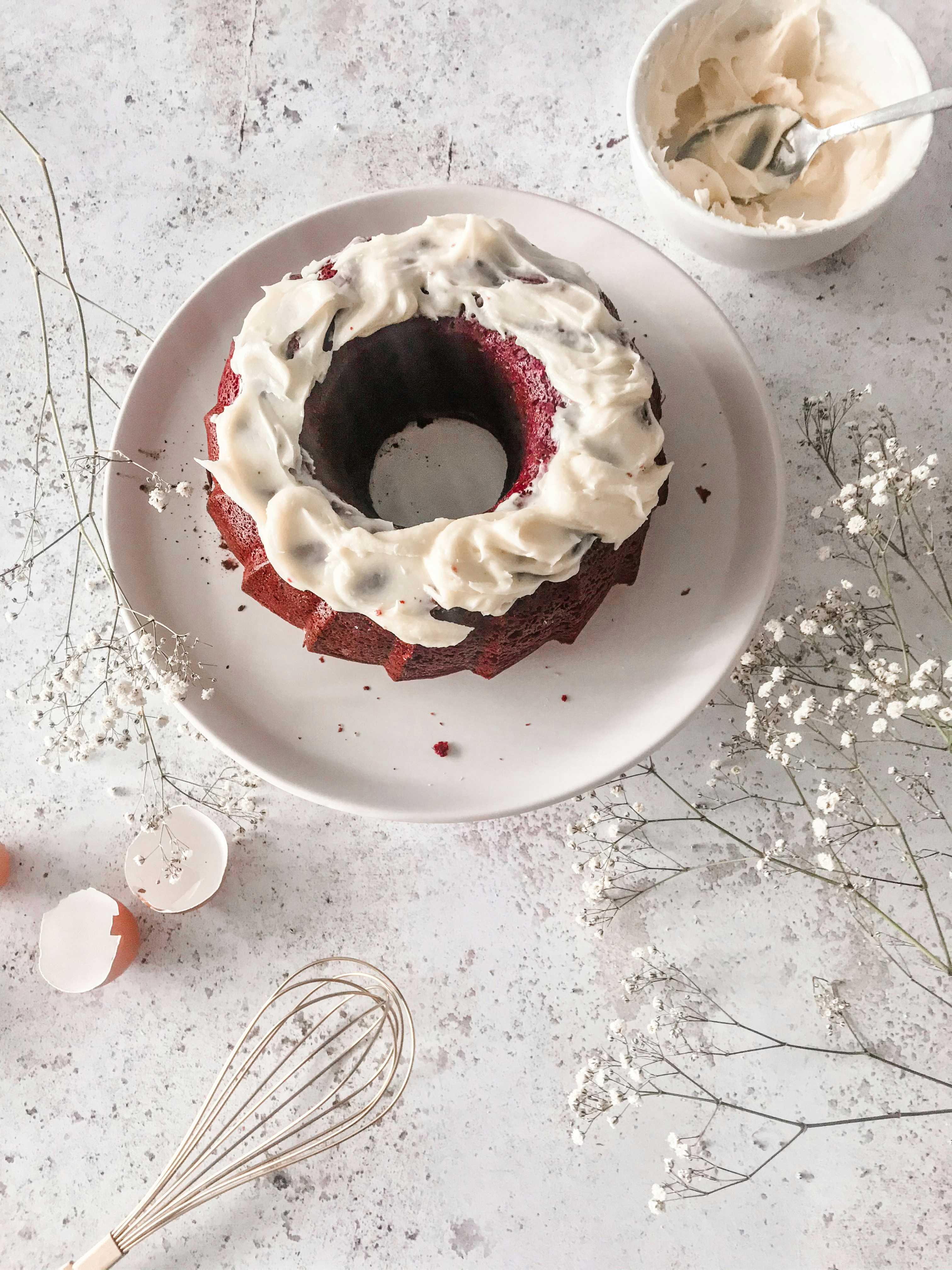 Red velvet bundt cake with cream cheese buttercream frosting