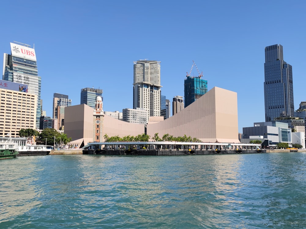 a body of water with a city in the background