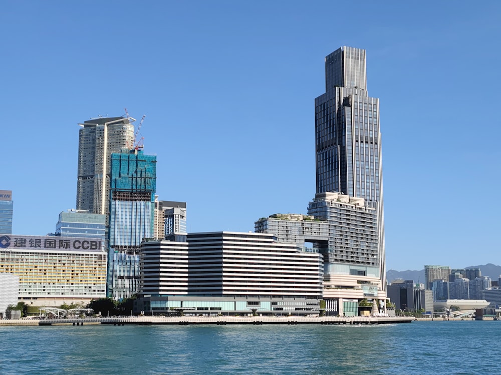 a large body of water with a city in the background