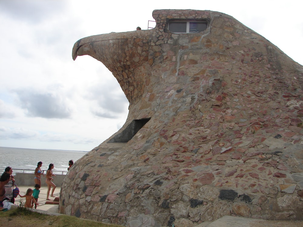 a large stone structure with a window on top of it