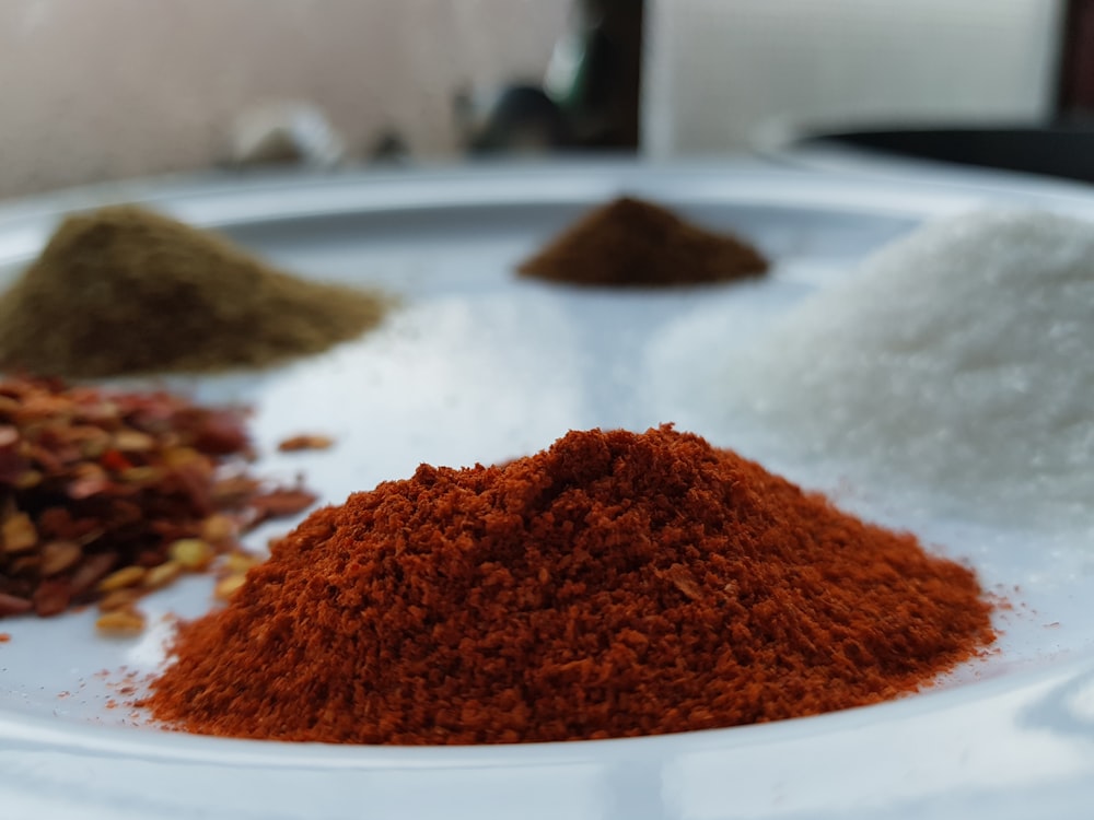 a white plate topped with lots of different types of spices