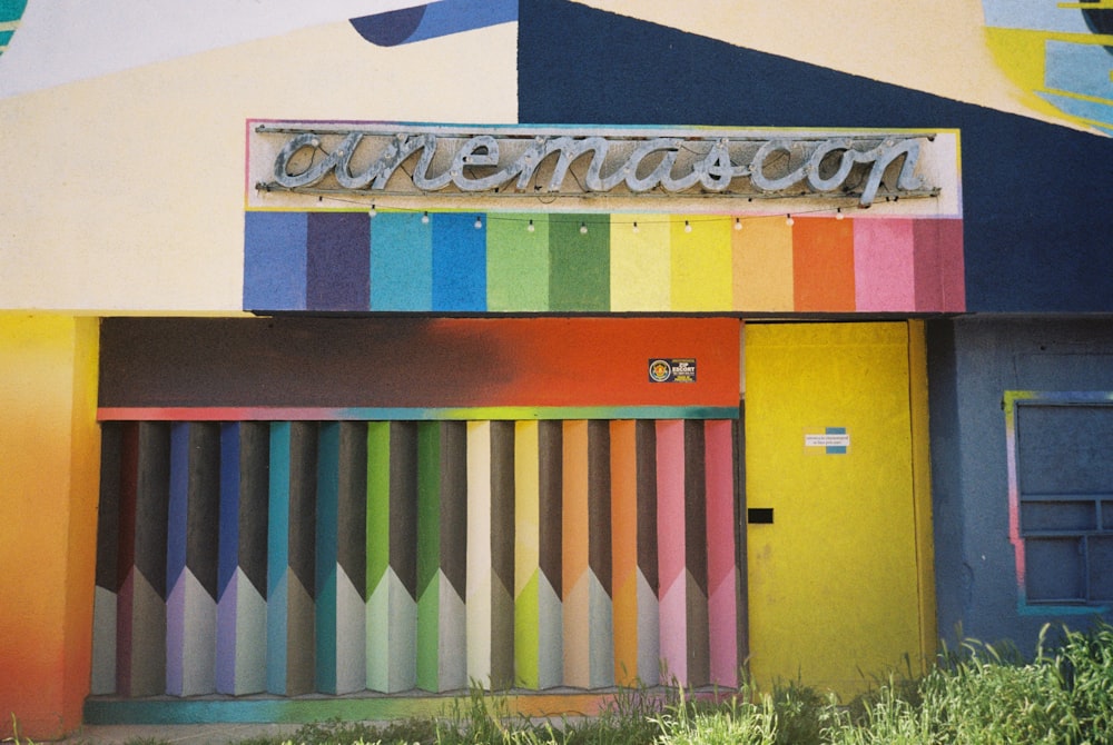 a colorful building with a sign on the front of it