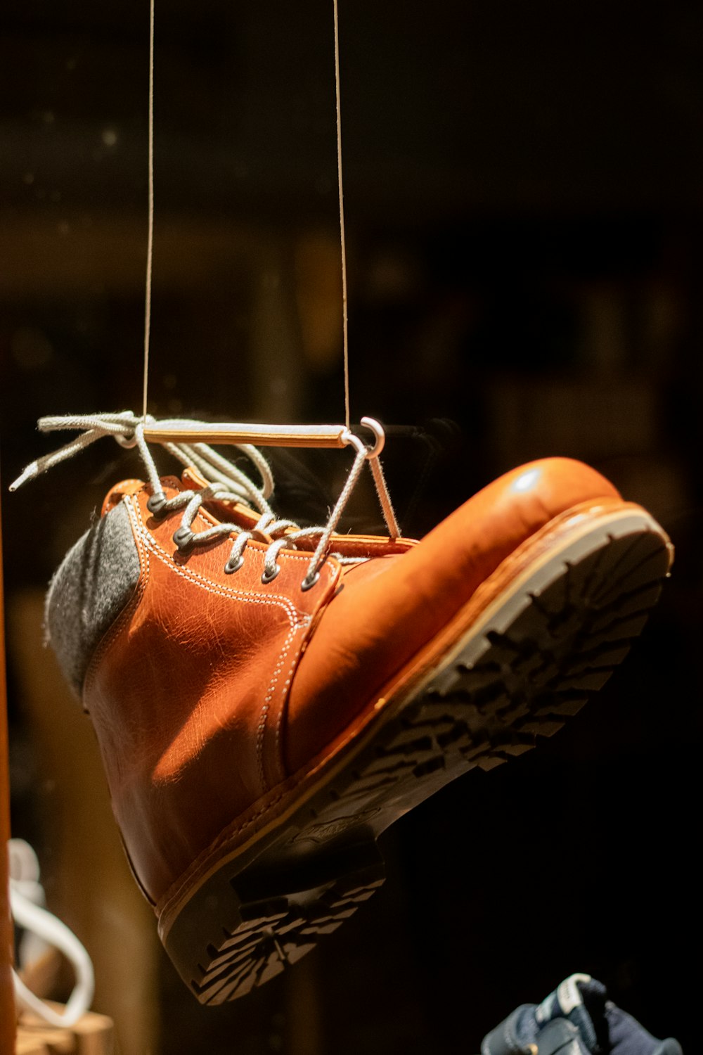 a pair of shoes hanging from a rope