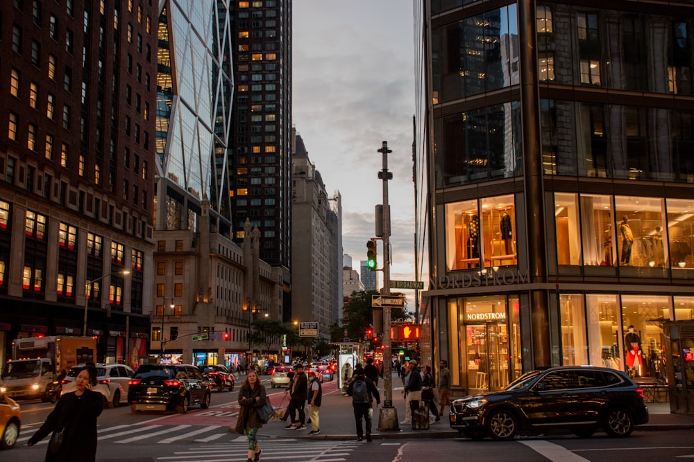 a group of people crossing a street in a city