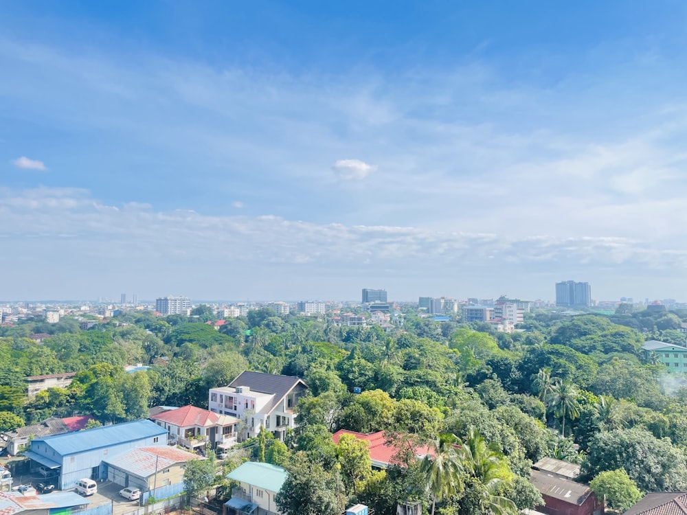 an aerial view of a city with a lot of trees