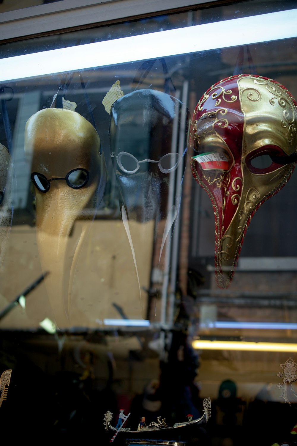 a couple of masks that are in a window