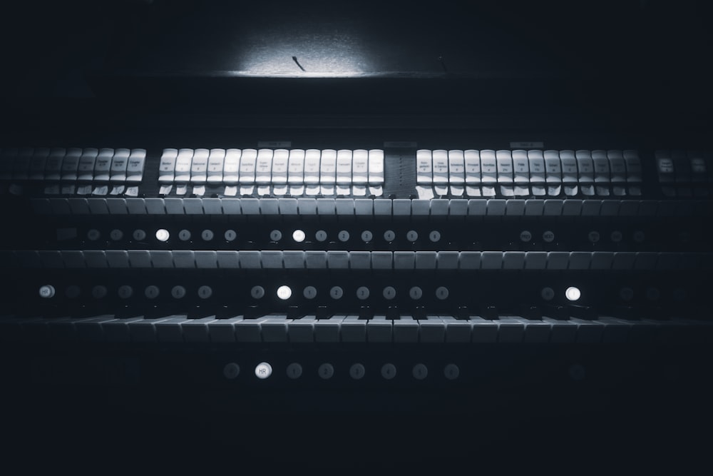 a black and white photo of a row of lights