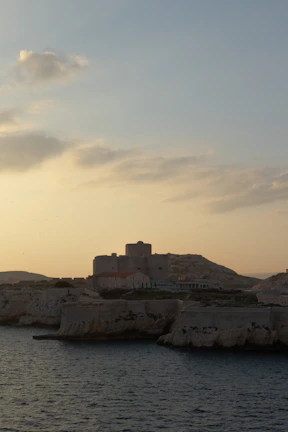 A serene view of Galle Fort’s historic ramparts overlooking the ocean at sunset.