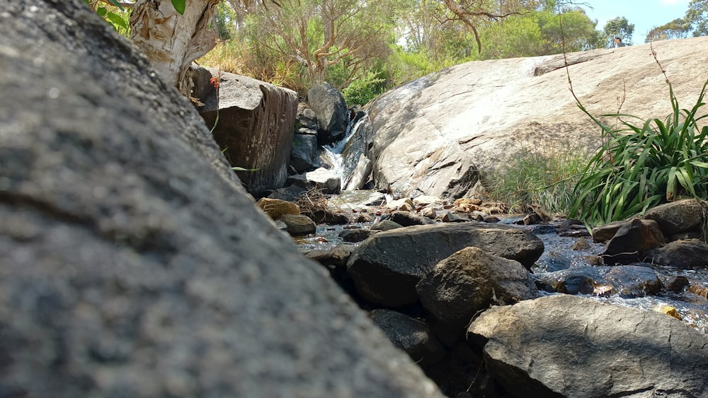 a stream of water running between two large rocks