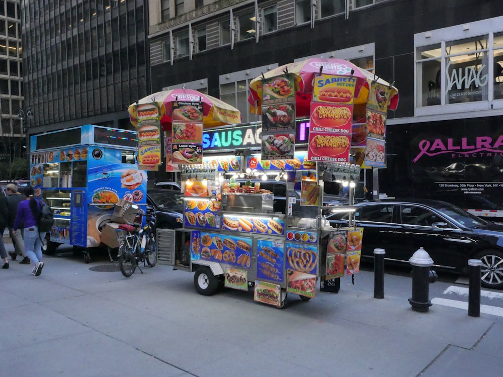 a food cart parked on the side of a street